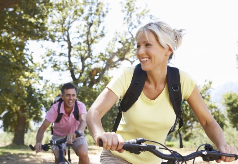 Man and woman riding bikes