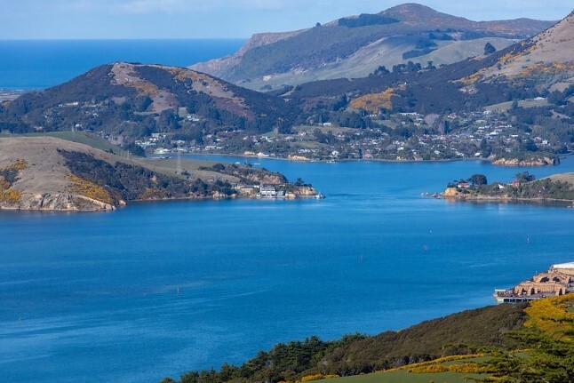 Picture of a body of water surrounded by mountains