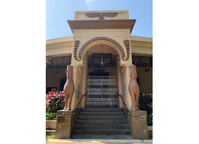 Front entrance to the Rustom Faramna Agiary fire temple. There are two human-headed winged bulls, called ghoda, on either side of the entrance.