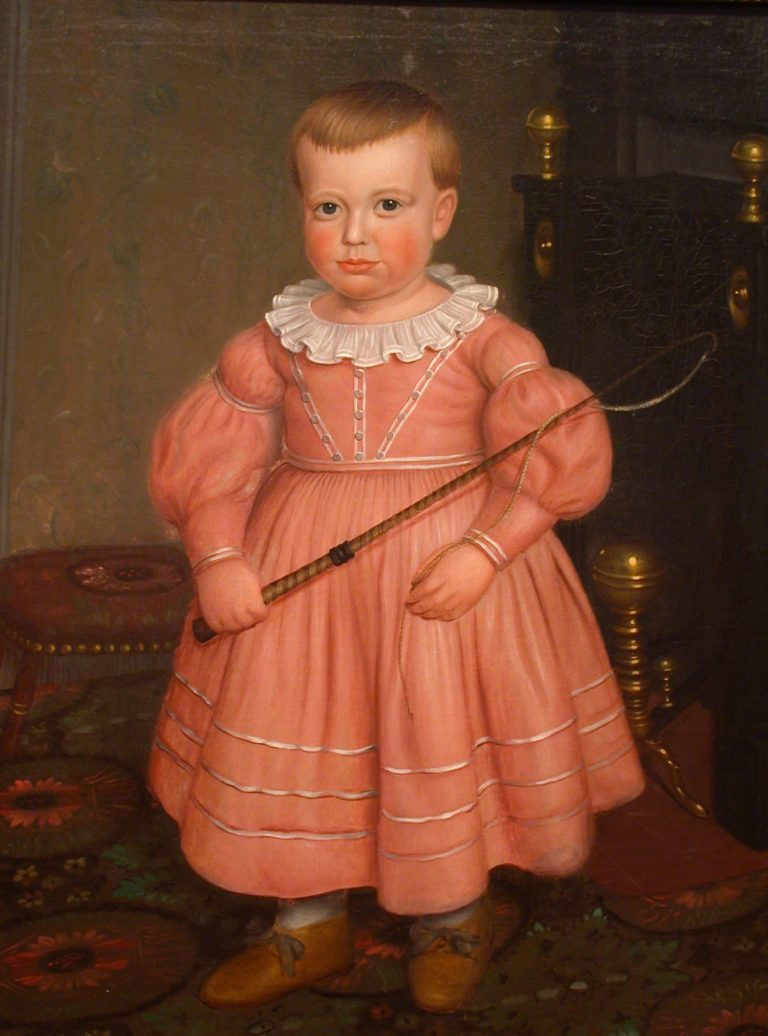A seventeenth century portrait of a small boy, holding a whip. He is wearing a pink dress