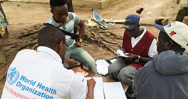 A meeting with members of the ebola response team of the World Health Organization and local community members