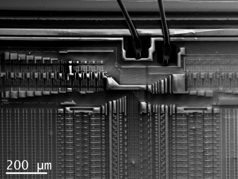 Electron microscope image of a microchip with 200 micrometre scale bar