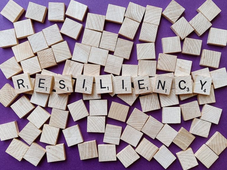 Wooden tiles with letters spelling the word 'resiliency