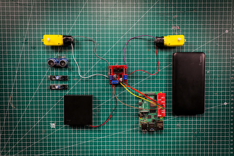 The components that will need to be attached to the robot buggy chassis - Raspberry Pi, motor controller board, 2 DC motors, ultrasonic distance sensor, 2 line sensors, AA battery holder, USB battery pack