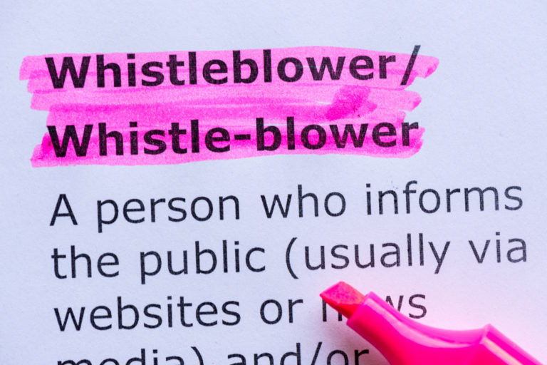 The word Wistleblower marked in pink marker pen