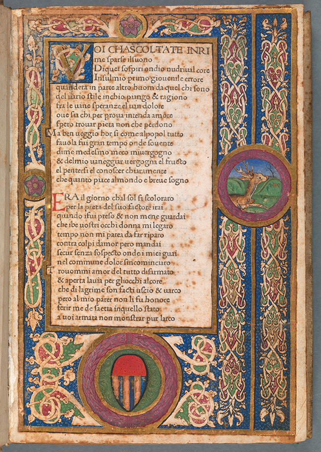 Woodcut templates on the first folio of Petrarch with coloured detail around the side of the page and text in the middle, *Canzoniere* (Vindelinus de Spira, 1470), fol. 1r. © The Board of Trinity College Dublin.