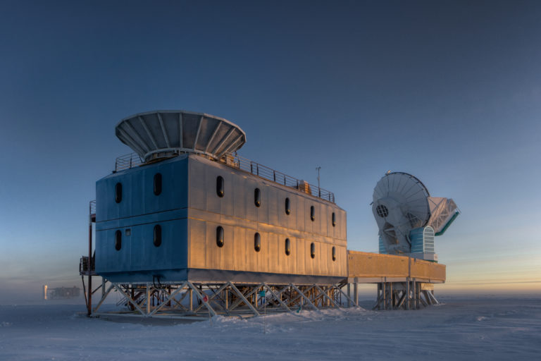 The Dark Sector Lab (DSL), located 3/4 of a mile from the Geographic South Pole, houses the BICEP2 telescope (left) and the South Pole Telescope (right). (c) Steffen Richter, Harvard University
