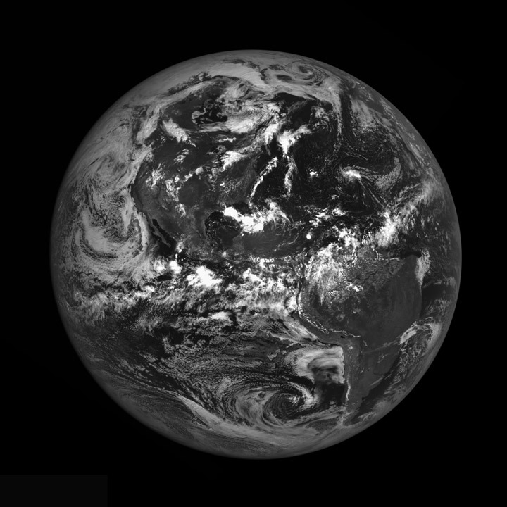 A black and white satellite image showing the Earth from space