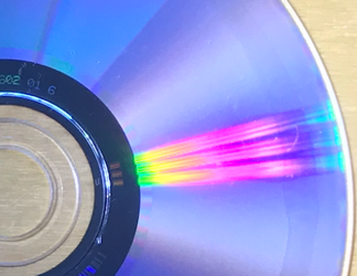 CD diffracting light to show rainbow patterns