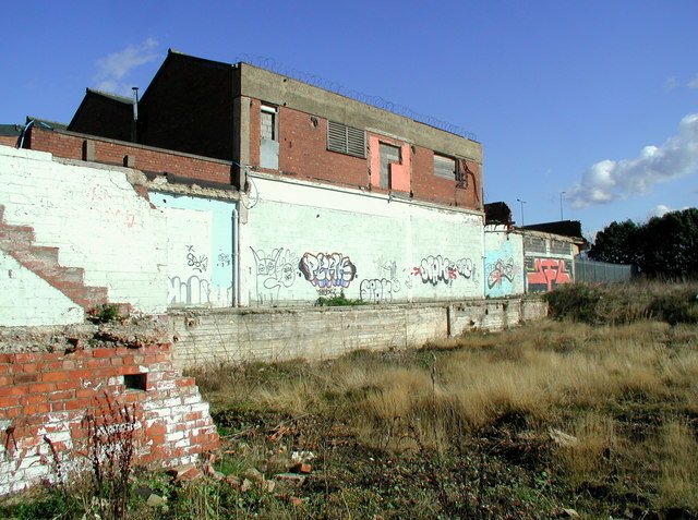 A photograph showing the land next to a building, Hull. The land looks underused and vacant