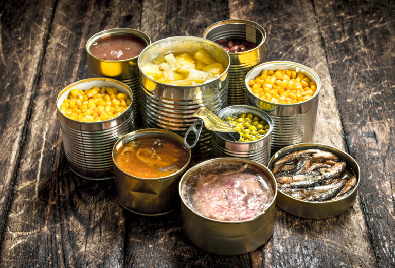selection of tins opened and showing contents of sweetcorn, beans, pineapple and fish