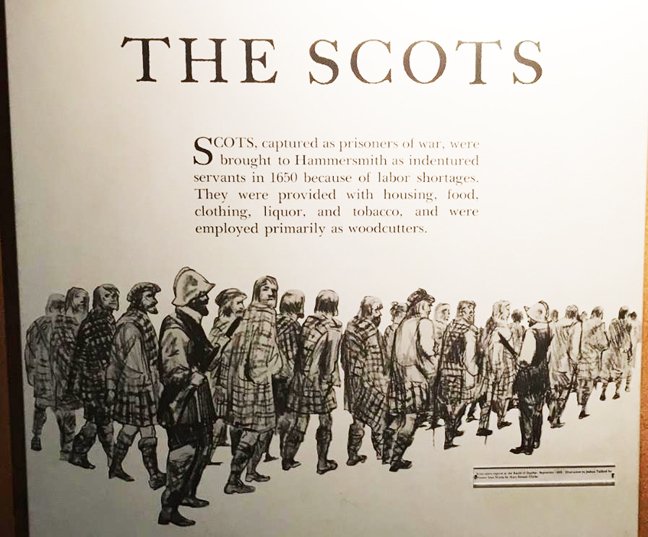 Detail of the panel from the Scots exhibit. The text reads: 'The Scots. Scots, captured as prisoners of war, were brought to Hammersmith as indentured servants in 1650 because of labor shortages. They were provided with housing, food, clothing, liquor, and tobacco, and were employed primarily as woodcutters.