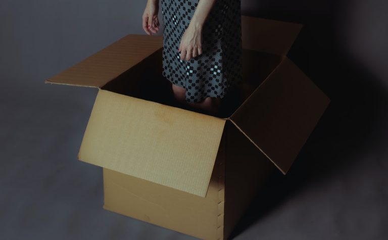 woman standing in a box