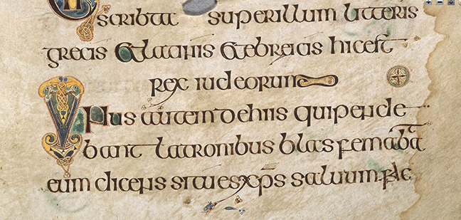 Figure 2, from the Book of Kells, lines of text with an image of two snakes intertwined