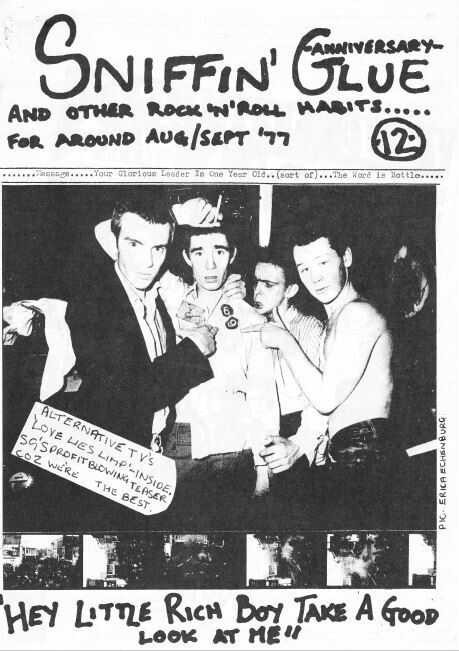 front cover of *Sniffin' Glue* Aug/Sep 1977 featuring black and white photo of 4 young men and the headline, 'Hey little rich boy, take a good look at me'