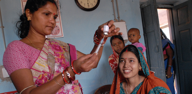 Indian female health worker preparing vaccination