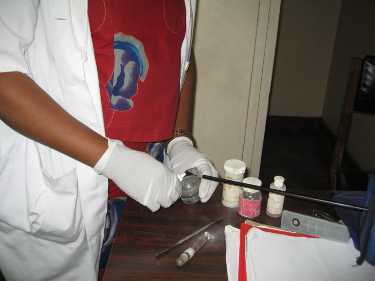 Dental assistant preparing amalgam containing mercury