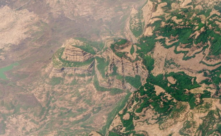 Aerial shot showing the rugged mountains and unusual landscape of the Deccan Traps in Maharashtra, India