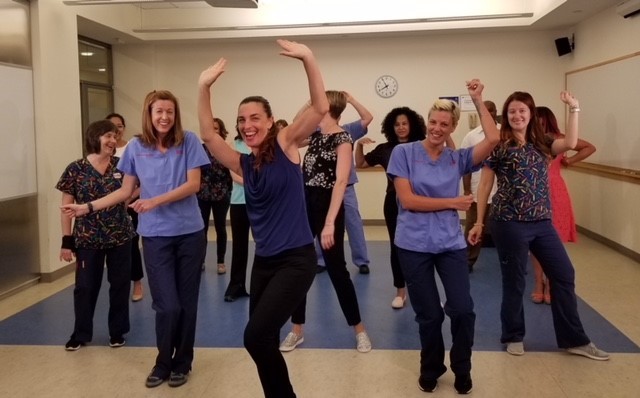 Michelle Bombacie leads NewYork-Presbyterian Hospital nurses in a dance movement class.