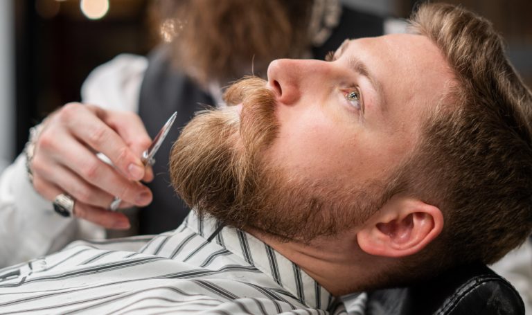 Man’s beard being trimmed