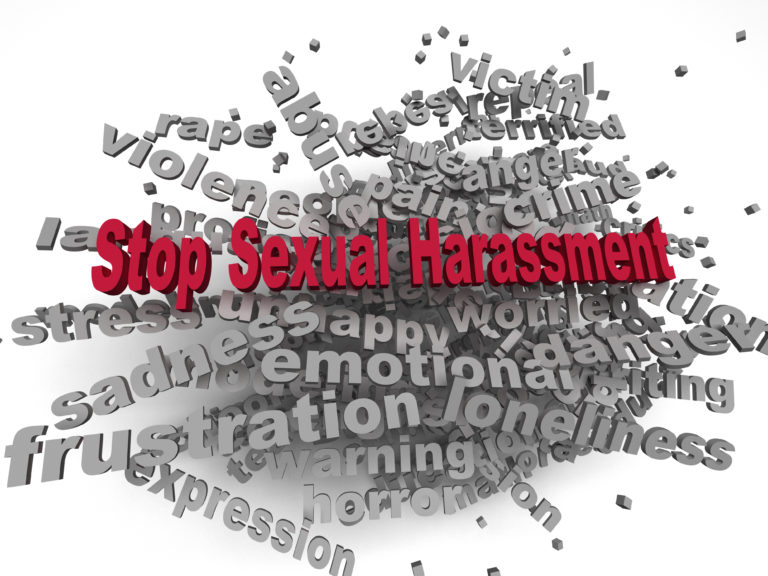 A sign saying "Stop sexual harassment"