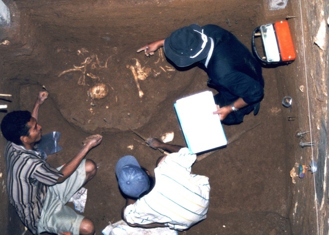 Photograph of the moment when the partial skeleton of Homo floresiensis was unearthed