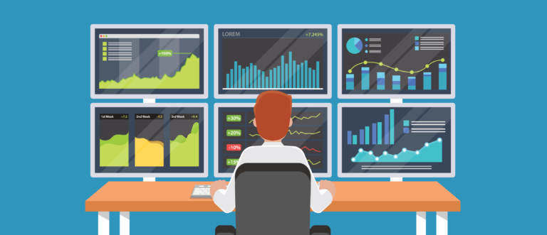 Businessman or stock market trader working at desk with multiple screens showing statistics