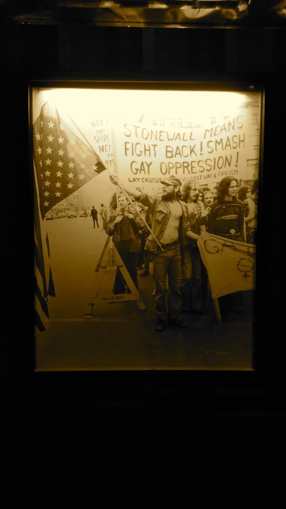Framed photo of people marching against gay oppression