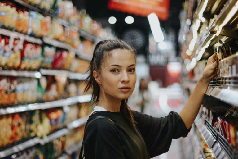 Woman selecting groceries in a supermarket