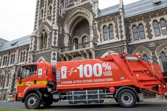 An orange electric truck