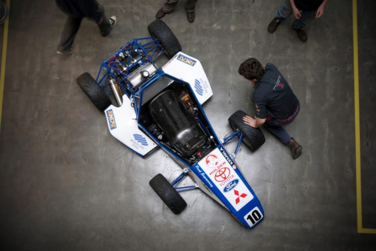 Image of UOW car being adjusted prior to testing the battery in race conditions