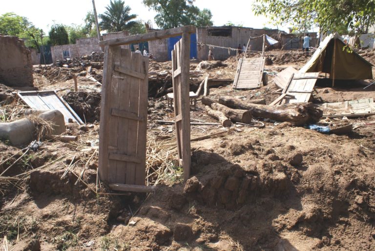 Photograph of a house door frame standing alone in the destroyed Lunda village in Charsadda district, Pakistan after the 2010 flood.