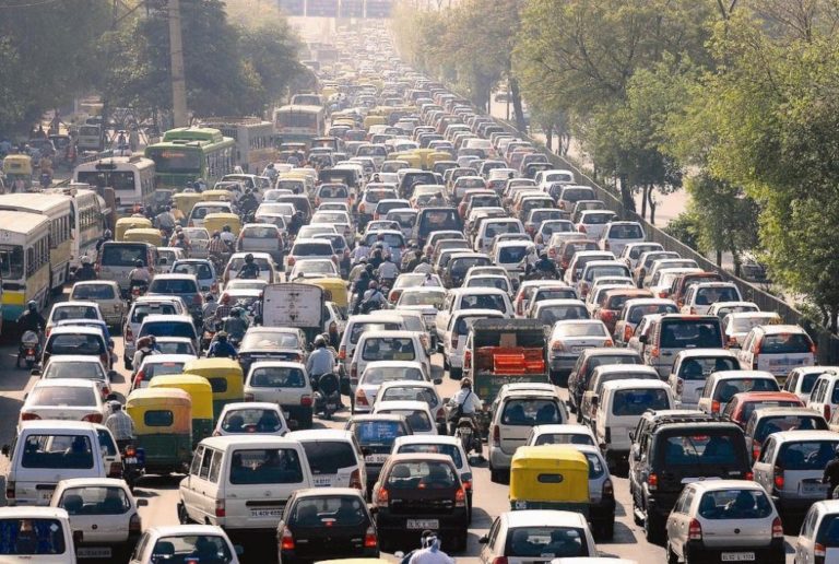 many cars and motorcycles in a traffic jam