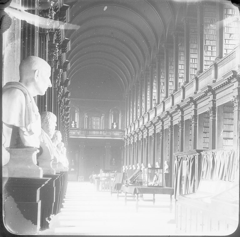 A black and white image of The Long Room of Trinity Old Library at the end of the nineteenth century. 