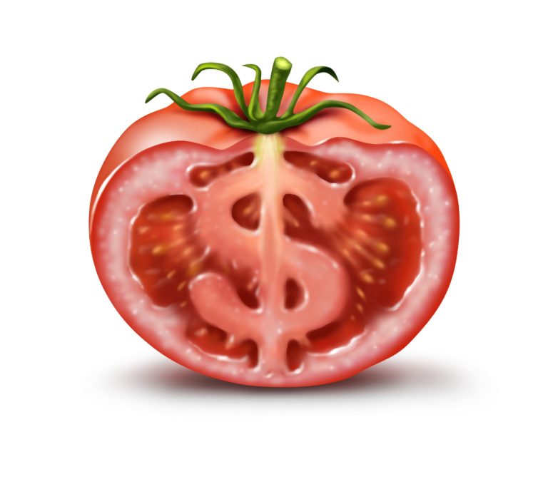 A cartoon of a tomato cut in half, with an image of a dollar sign ($) making up the central core of the fruit