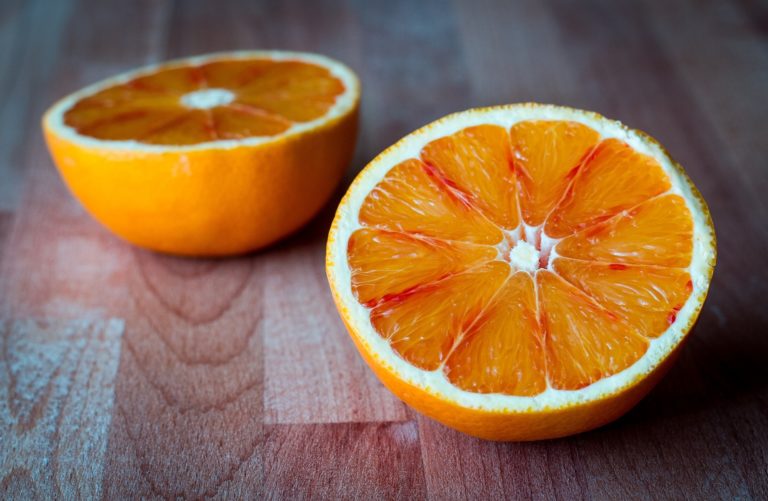 Photo of an orange cut in half