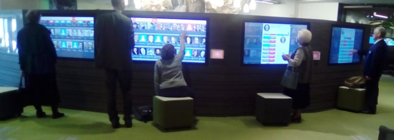 People interacting with touchscreens