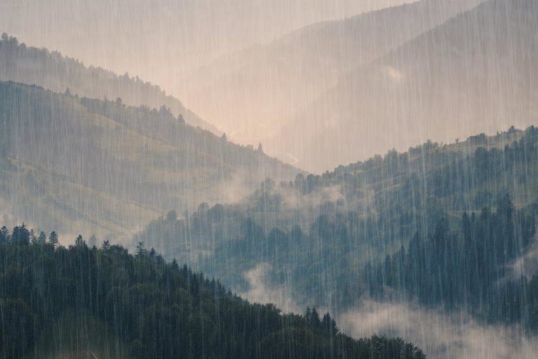 Photograph of some mountains in the rain