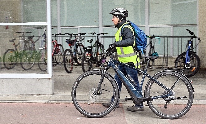 A men walking with his bicycle