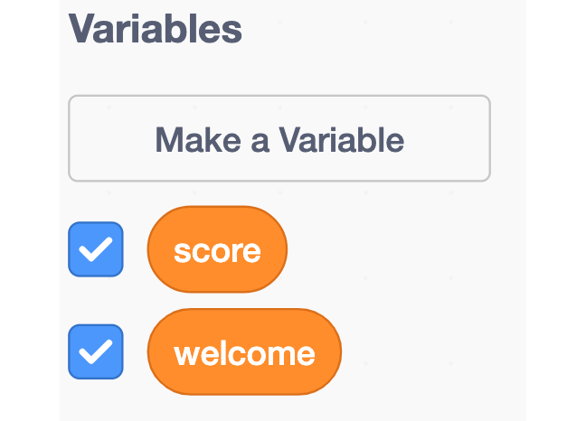 An image showing the score and welcome variable in the blocks palette of Scratch