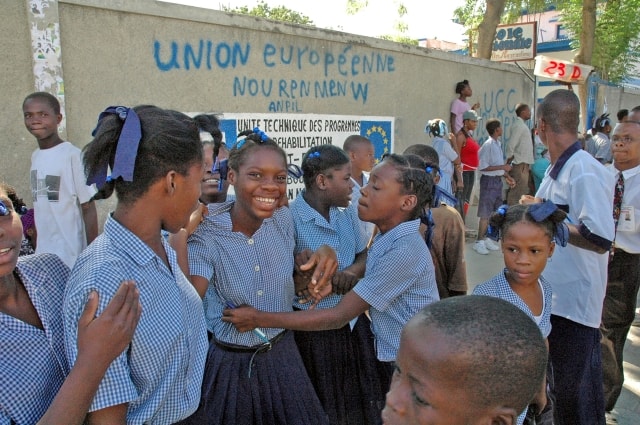 Pupils playing outside a school built with EU funds in Haiti