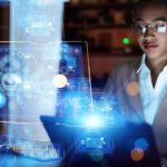 Young woman working in the night office. System engineering. Digital transformation.