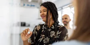 A woman smiles while she works