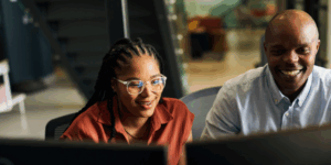 two people at laptop
