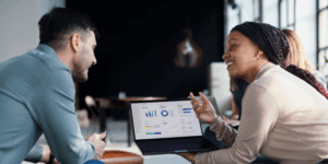 two coworkers discussing data