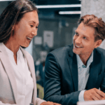 two office workers discussing business analysis