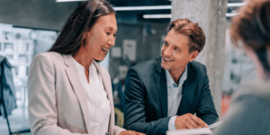 two office workers discussing business analysis
