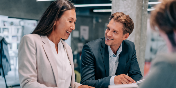 two office workers discussing business analysis