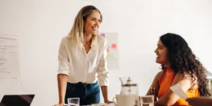 Two women in a work office