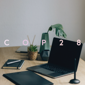 laptop with 'COP 28' written on top